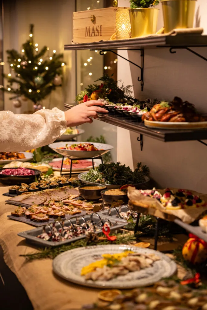 A lavishly set Christmas buffet featuring cold cuts, herring dishes, and festive sides at Starby Spa & Hotel